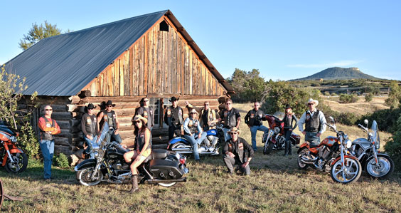 group photo outside a barn