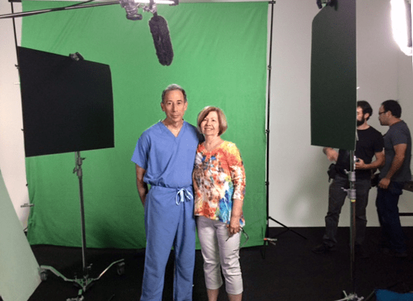 Photo of sue on green screen with doctor