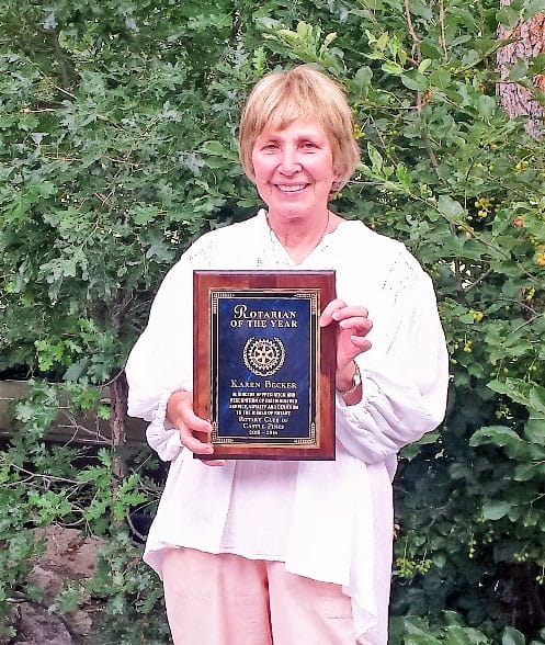 woman holding plaque