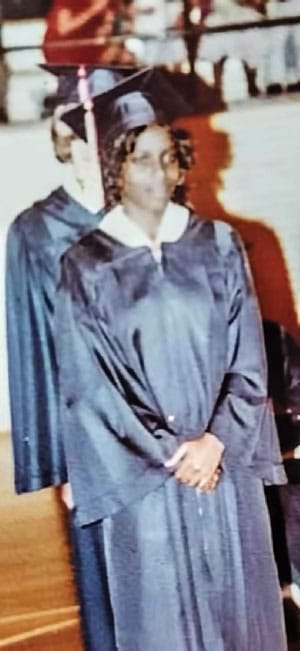 Photo of Yvonne in graduation cap and gown