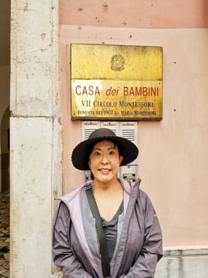 Photo of Ryoko outside the birthplace of the “Montessori Method” in Rome, Italy.