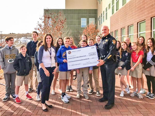 Photo DCSO Captain Troy McCarty accepts donation to DC Fallen Officers Fund