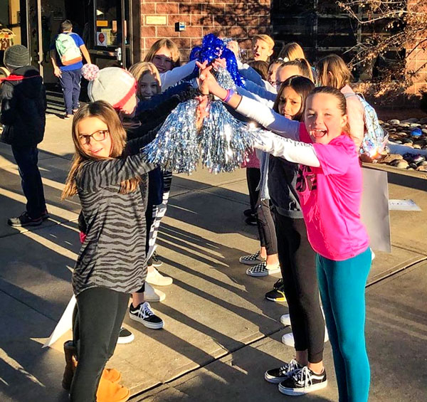 Photo of Timber Trail students welcome classmates back to school