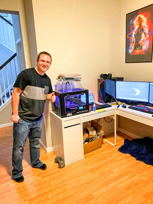 Photo of Rock Canyon High School CTE teacher, Kyler Barker printing 3D face shields.