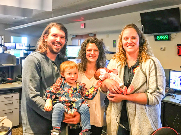 Photo of Missy Piche with family and baby she helped deliver via Douglas Regional Dispatch