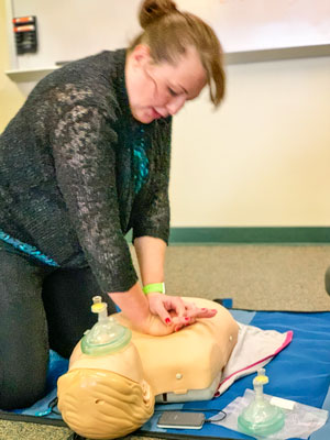 Photo Castle Pines City Clerk Tobi Basile learning CPR