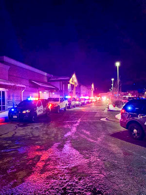 Photo of Police Officers honoring K-9 Offficer Ronin