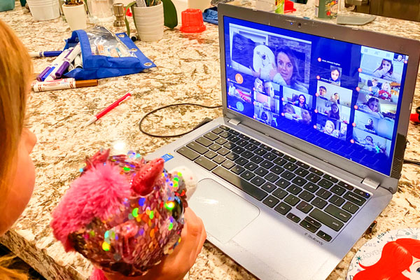 Photo of Andrea Gale reading to her kindergarten class via video call. 