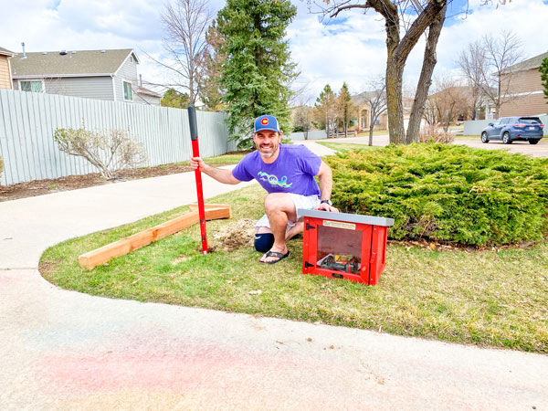 Photo of Michael Dauro installs the new Little Free Library