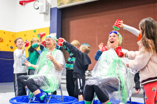 Photo of Never lacking school spirit, Ronda Gutierrez gets slimed at a school assembly after fundraising for the American Heart Association’s Jump Rope for Heart.