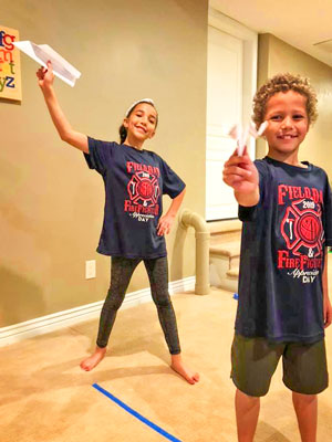 Siblings Joshua and Juliana Perez challenge each other in a game