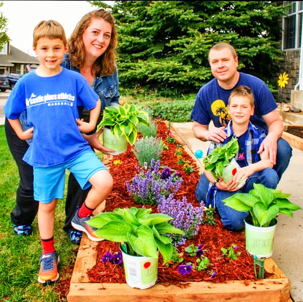 Photo of Liepins family and garden