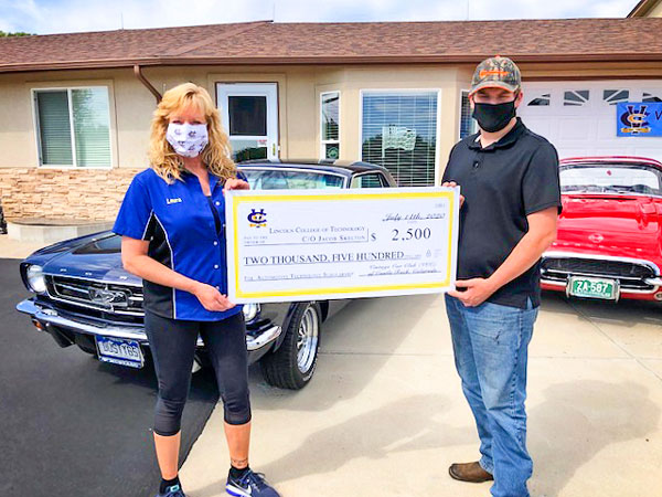Photo of vintage Car Club of Castle Rock presents scholarship check