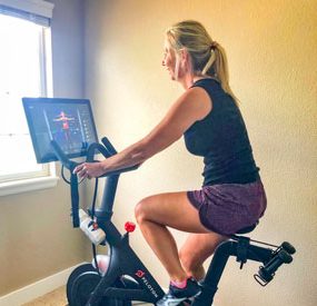 Photo of Michelle Stutler on her Peloton bike