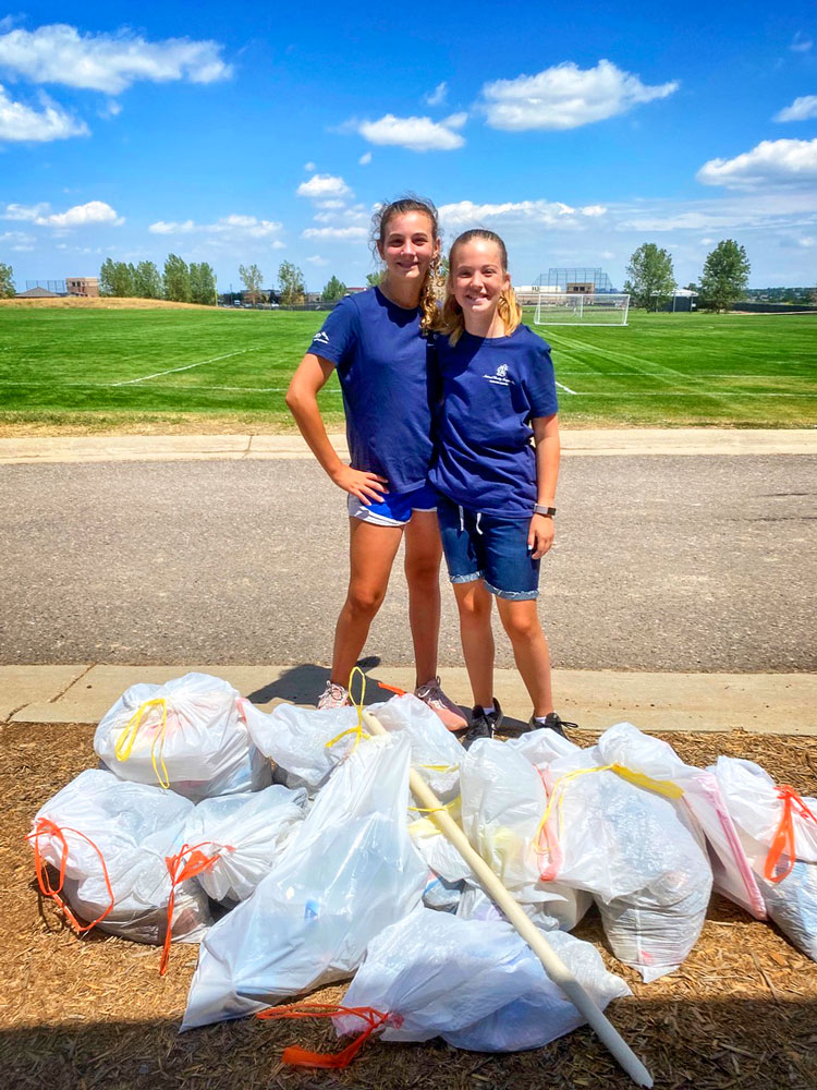 Photo of girls from Elevation Chapter of National Charity League participates in clean-up activities around Douglas County