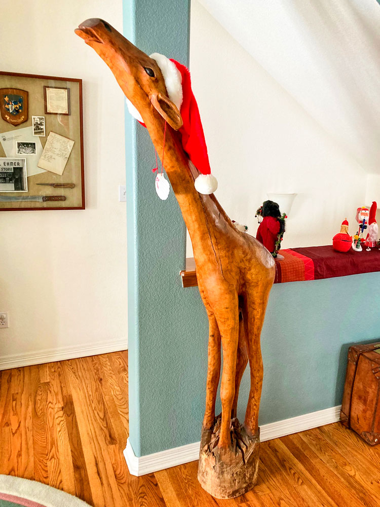 Photo of 6-foot giraffe carved of red swamp cypress.