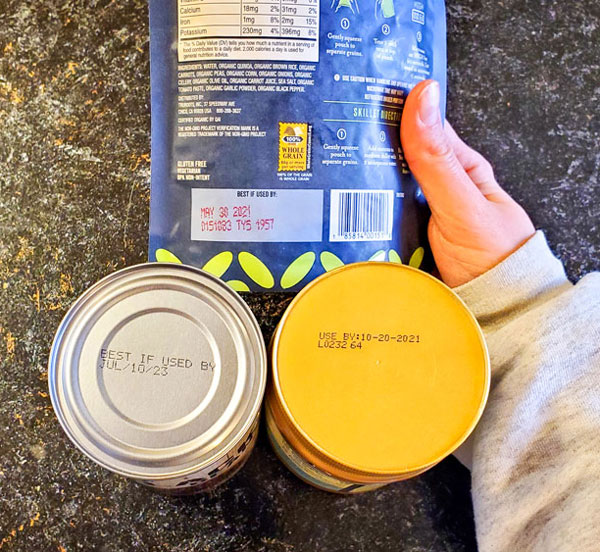 Photo of canned goods howing expiration dates
