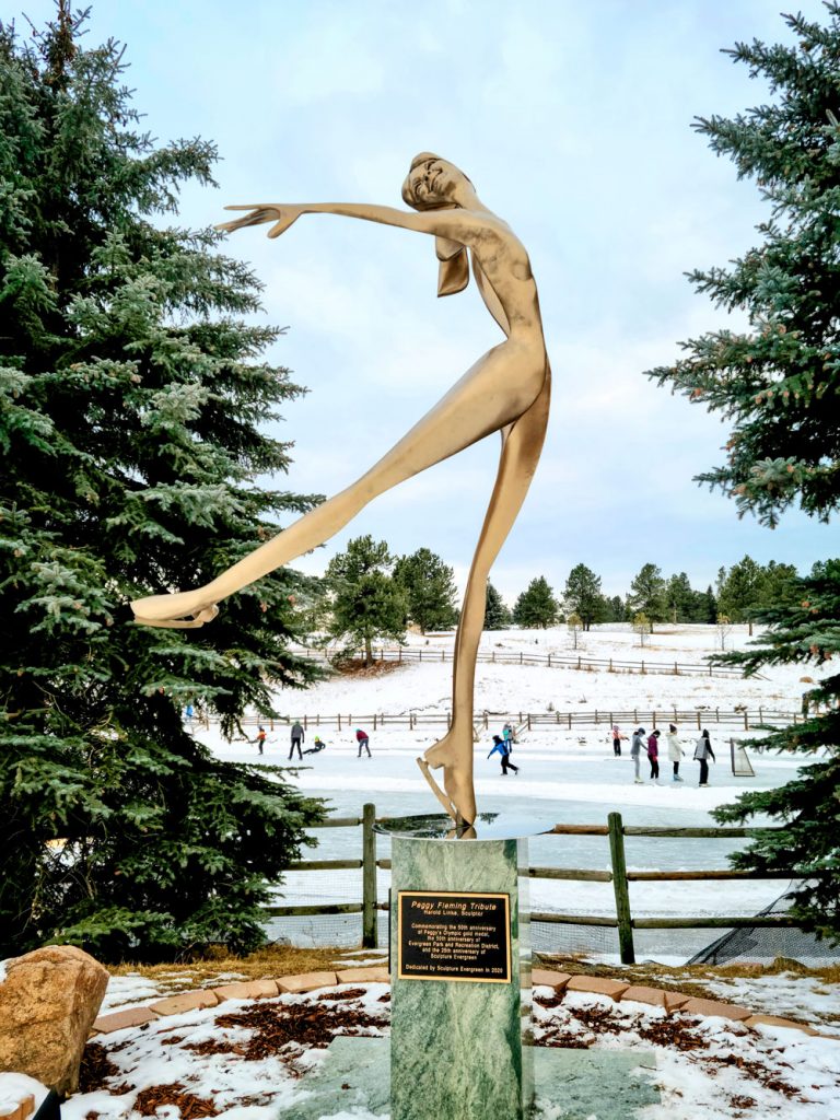 Evergreen Lake House stands the Peggy Fleming sculpture 