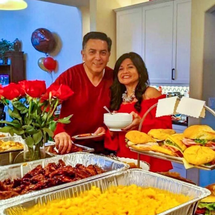Photo of Xavier and Rina Castanon at one of their Super Bowl parties.