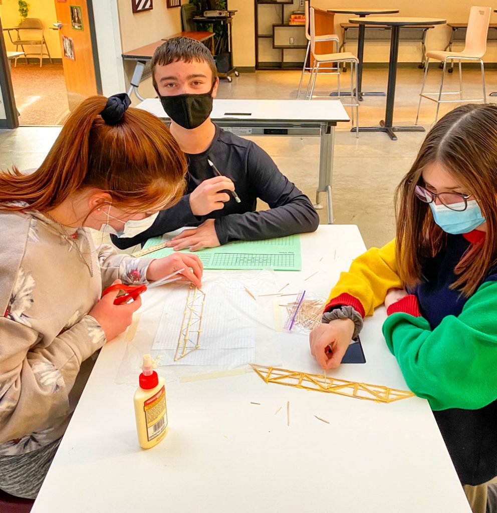 Photo of Eddie Razam begins building her toothpick bridge