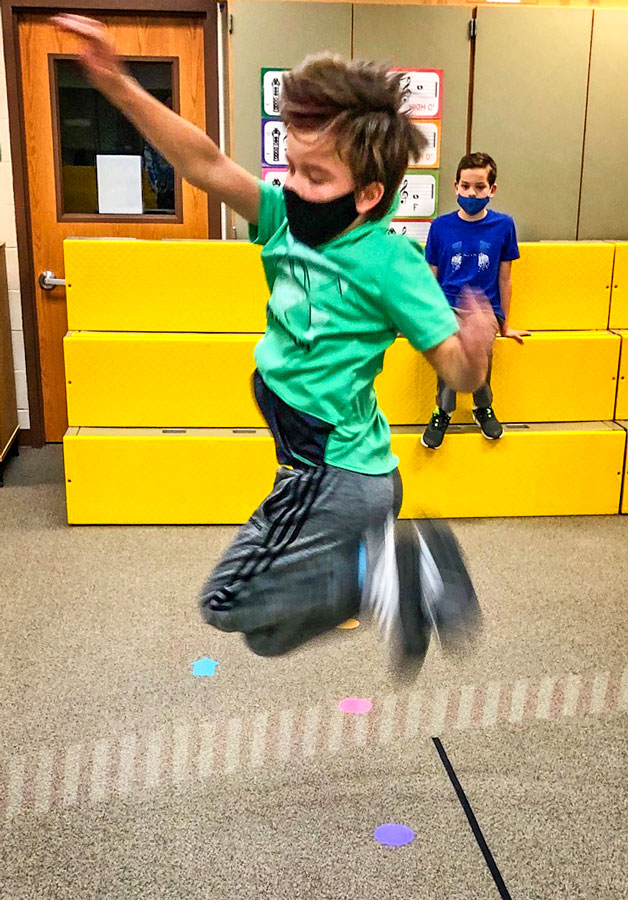 Photo of Cameron Goode takes on an individual jumping challenge.