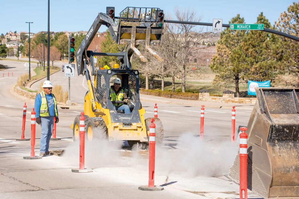 Repairing the persistent potholes that are ever-developing on the road in Castle Pines