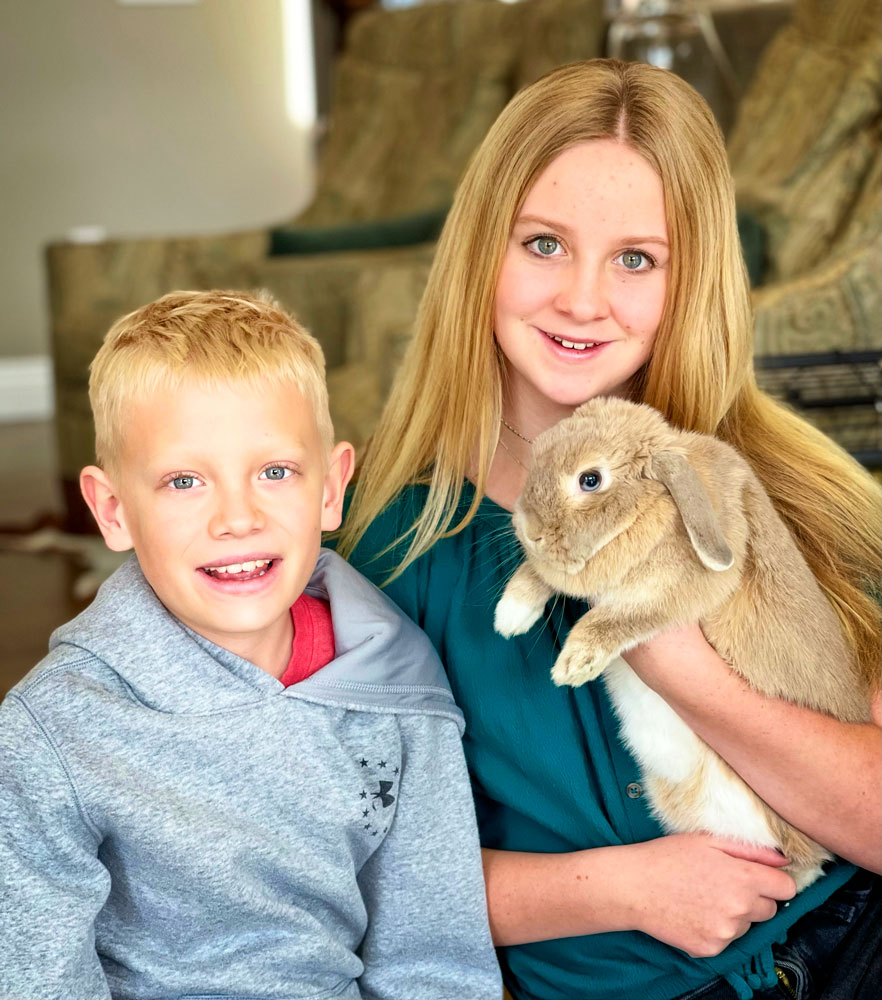 Photo of Parker and Katelyn Calfee with their pet bunny