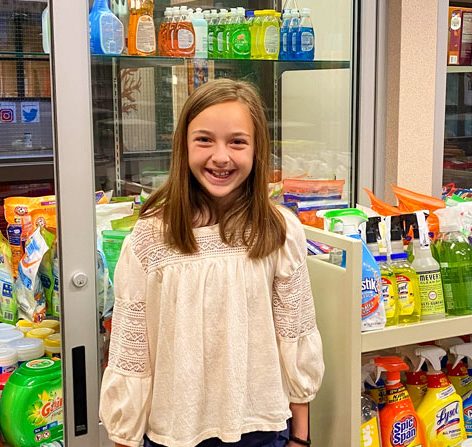 Photo off Fourth grader Madi Petau really enjoyed participating in the school food drive.