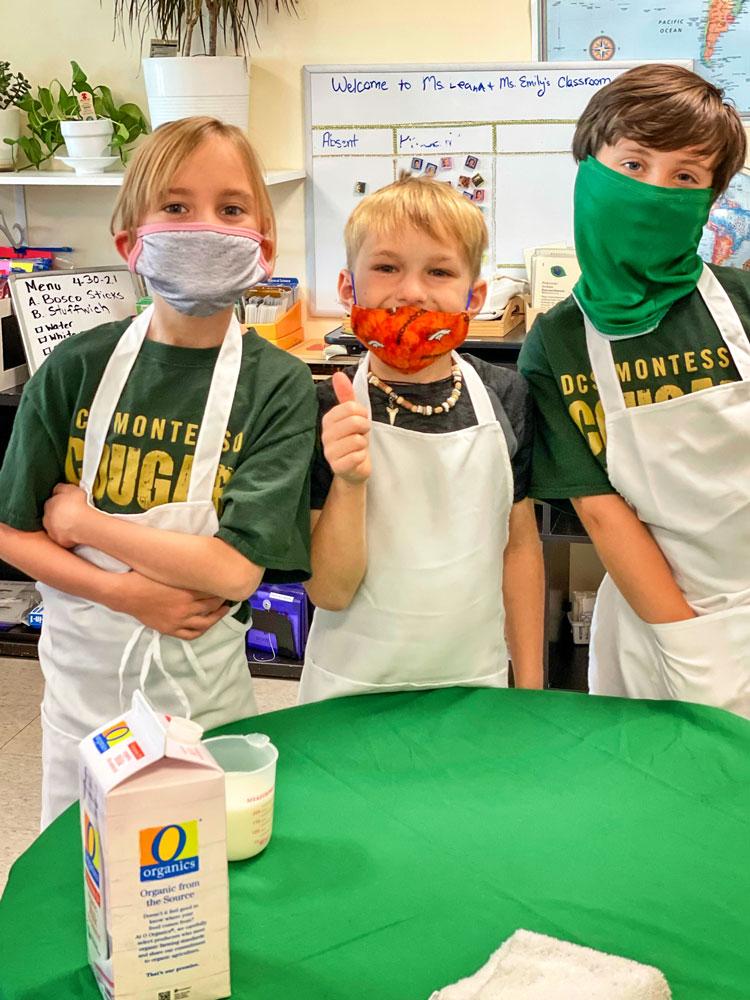 Photo of classmates work together to make the perfect batch of pão de queijo