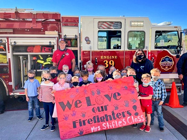 Photo of American Academy – Castle Pines honoring firefighters.