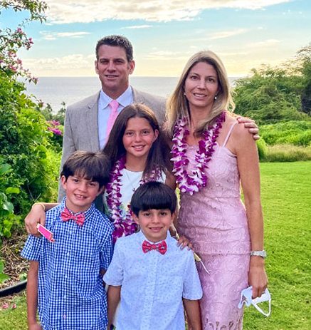 Photo of Drs. Michael and Laura Rosenberg at a wedding in Maui, Hawaii with their children Reese (11), Noah (9) and Cameron (7).