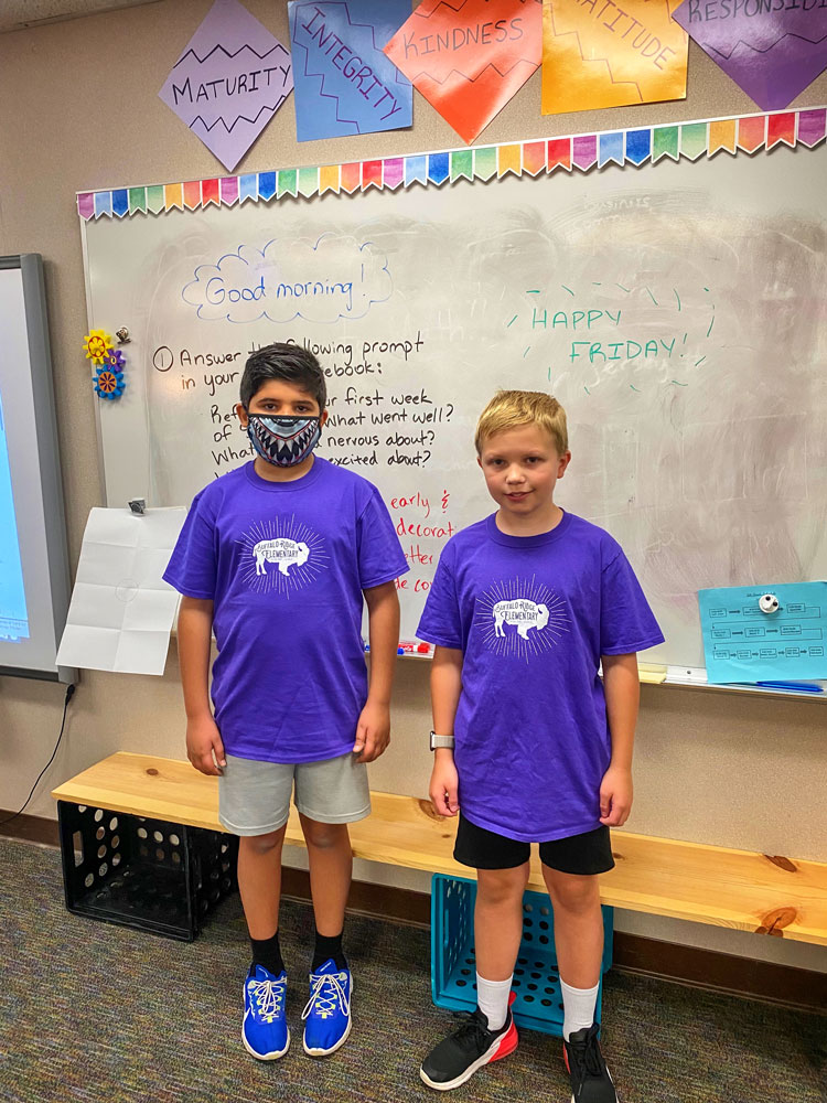 Photo of Thomas D. and Caleb M. standing in BRE classroom.