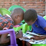 Photo of eager students who want to learn, students devour the books and supplies.