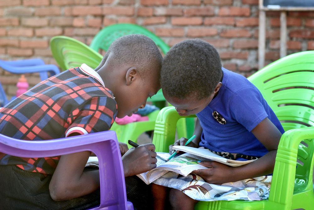 Photo of eager students who want to learn, students devour the books and supplies.