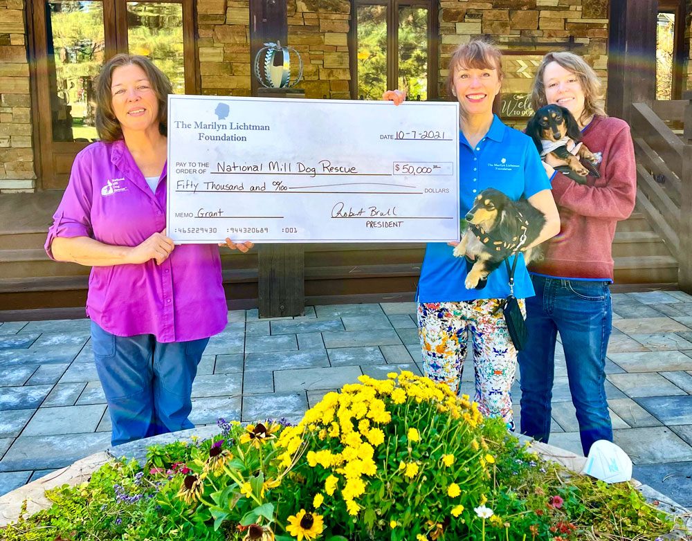 Photo of National Mill Dog Rescue, accepts a donation from The Marilyn Lichtman Foundation