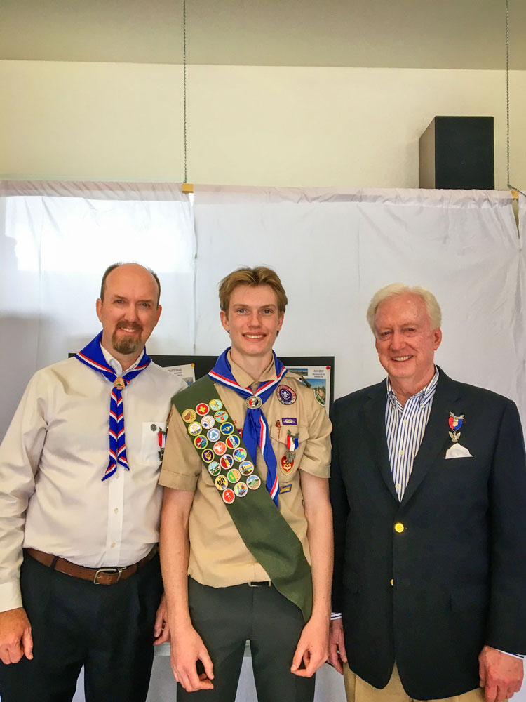 Photo of Three generations of proud Huffman Eagle Scouts: Jim (right) with his son Scott (left) and his grandson Otto (center).