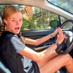 Photo of girl with newly-obtained driver instruction permit.