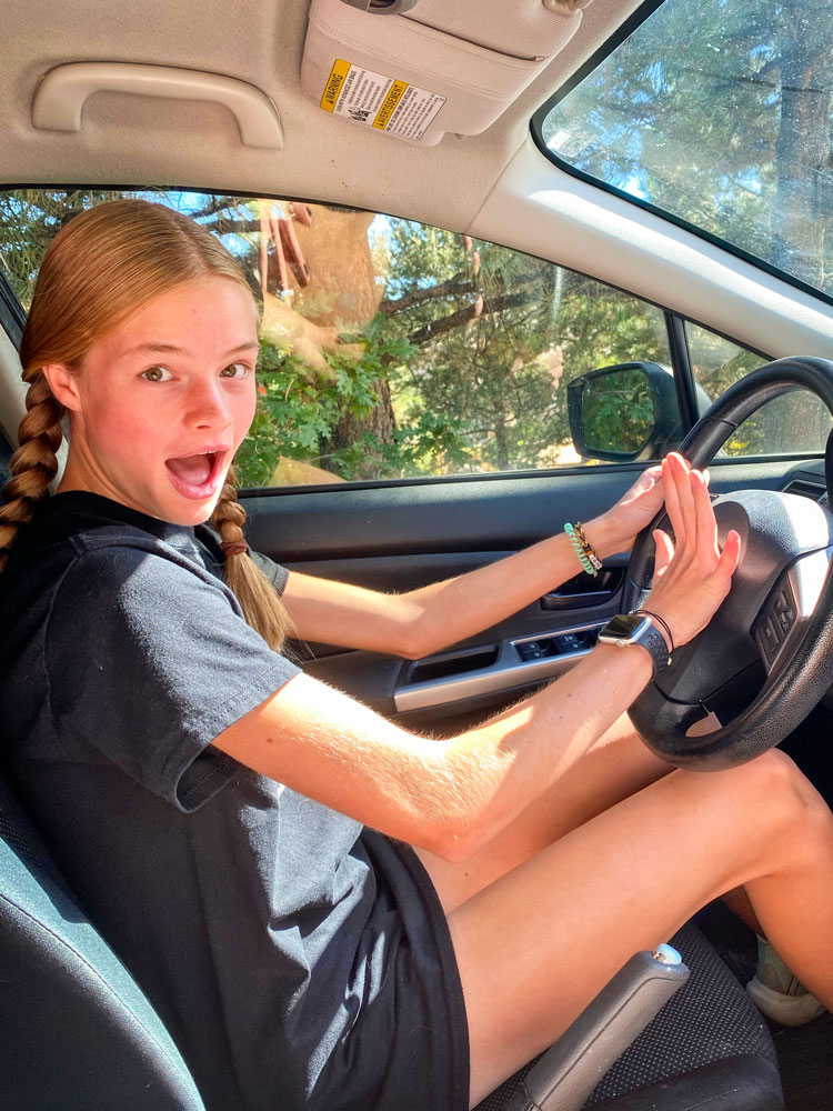 Photo of girl with newly-obtained driver instruction permit. 