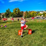 Photo of Wearing red and white to represent Japan, fifth grade student Caleb M. participates in a relay race