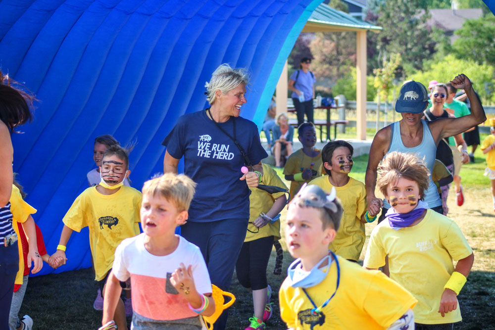 Photo of BRE Principal Jen Murdock-Jacoway running with second grade 
