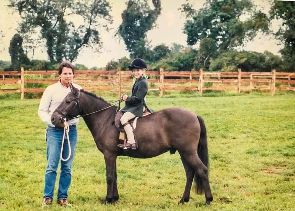 Photo of Erica Aizenman as a child on her horse farm in New Jersey.