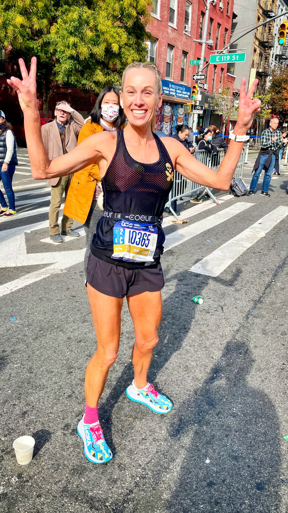 Photo of Stacia Wilkins who is all smiles at the New York City Marathon.
