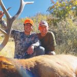 Photo of Greg Vigil with his son Eli during the first rifle season of 2021 hunting