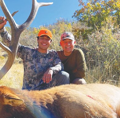 Photo of Greg Vigil with his son Eli during the first rifle season of 2021 hunting