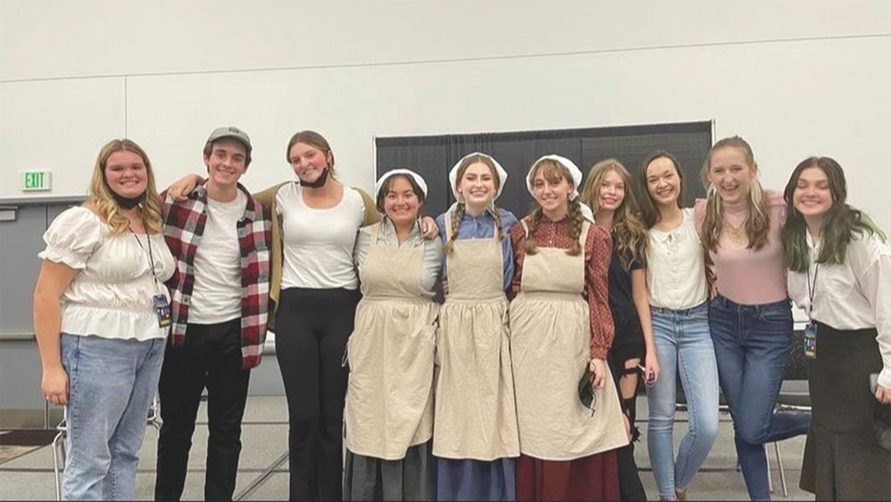 Photo of The Amish Project cast, left to right: Emily Johnson (director), Braden McCollam (Edward Stuckey), Alexis Murphy (Carol Stuckey), Jeriann Villegas (Anna), Gwen Riddoch (Mary), Savannah Ryan (Velda), Anna Benevento (America),