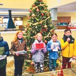 Photo of fifth grade Timber Trail students delivering hand-crafted holiday cards.