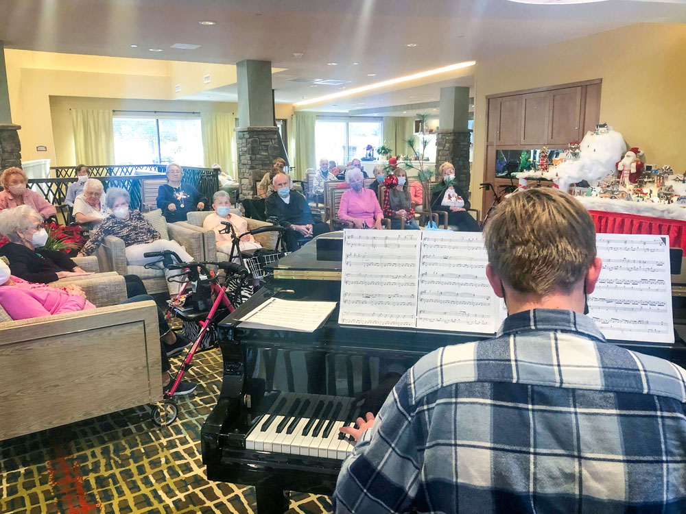 Photo of residents at Legacy Village enjoying music