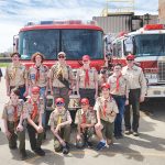 Pictured right: Members of Boy Scout Troop 316 at the South Metro Fire Rescue training facility in Parker. Front row kneeling (left to right): Will Knox, Lucas Gulliver, Asa Kelley, Jack Muggenthaler and Evan Martin; Back row standing (left to right): Jeff Pepper, Miller Duval, Alex Kohl, Tyler Pepper, Kiefer Duval, Landon Gulliver, Adam Knox and Scoutmaster DeLane Duval.
