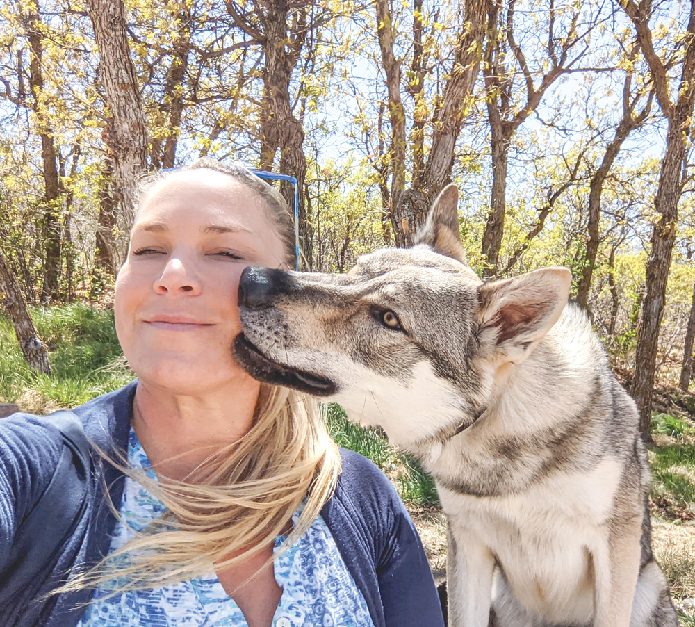 Photo of Katie D’Arcangelo with the family puppy, Fiver.