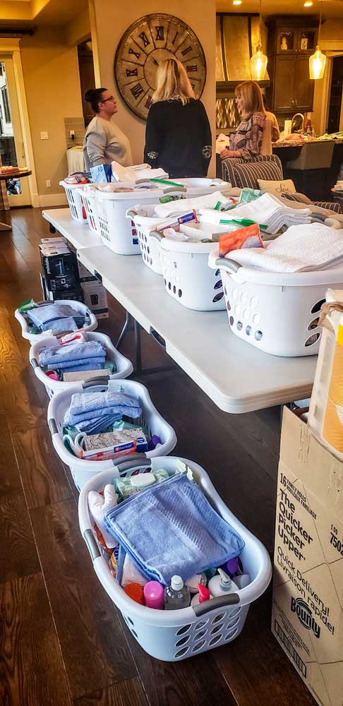 Photo of Women from The Church of Jesus Christ of Latter-day Saints with donated items. 